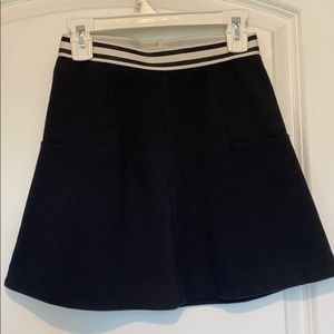 black skirt with white and black waistband